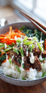 Korean Beef Bulgogi Bowls with creamy Gochujang sauce served over rice with fresh veggies